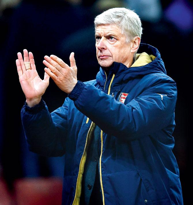  Manager Arsene Wenger applauds during Arsenal