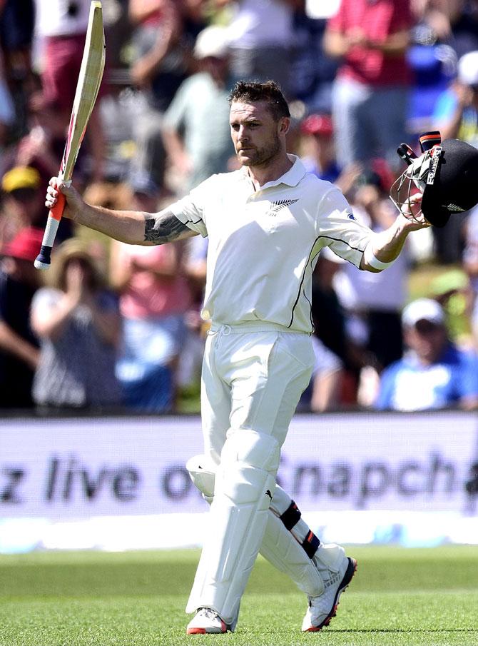 Brendon McCullum captain of New Zealand lifts his bat and helmet to the fans as he walks from the field for the last time during day one of the second cricket Test match between New Zealand and Australia at the Hagley Park in Christchurch. Pic/AFP