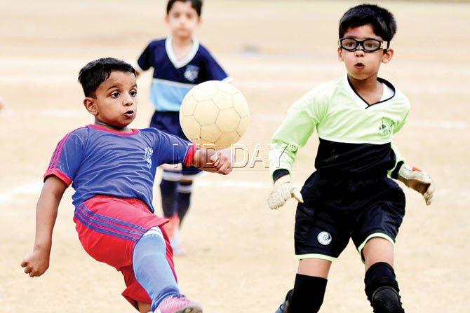 St Mary’s Mahsuwin Kumar (left) kicks the ball during MSSA inter-school boys U-8 final at Azad Maidan. PIC/SHADAB KHAN