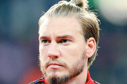 Nicklas Bendtner in the red over car photograph