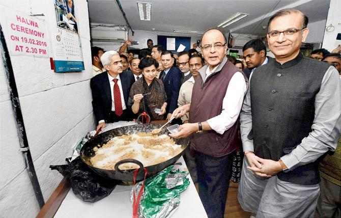 Finance Minister Arun Jaitley (centre) with MoS, Finance, Jayant Sinha (right) and officials of his ministry take part in the ‘Halwa Ceremony’ to mark the beginning of printing of budgetary documents, in New Delhi on Friday. Pic/PTI