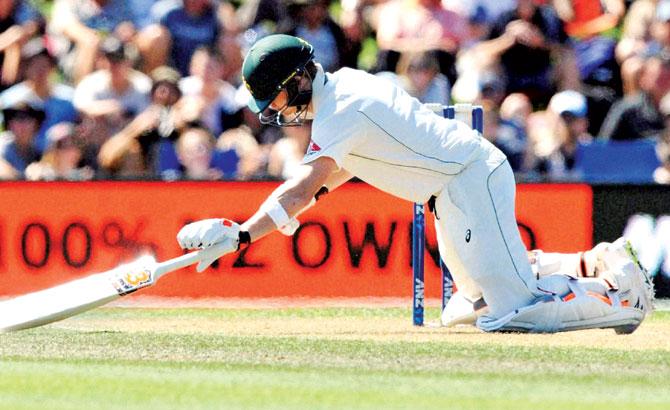 Australia skipper Steve Smith falls after being hit by a bouncer from New Zealand