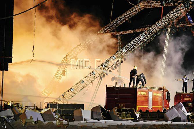 up in smoke: The fire had put an end to day two of the Make in India event, as the entire stage was engulfed in flames. PIC/SHADAB KHAN