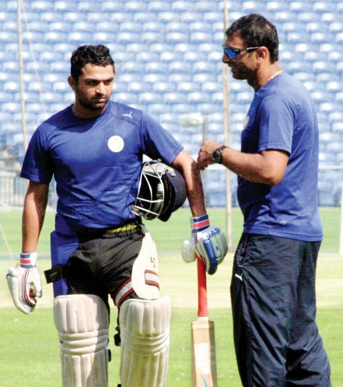 Saurashtra skipper Jaydev Shah  with coach Sitanshu Kotak at Pune’s MCA stadium yesterday