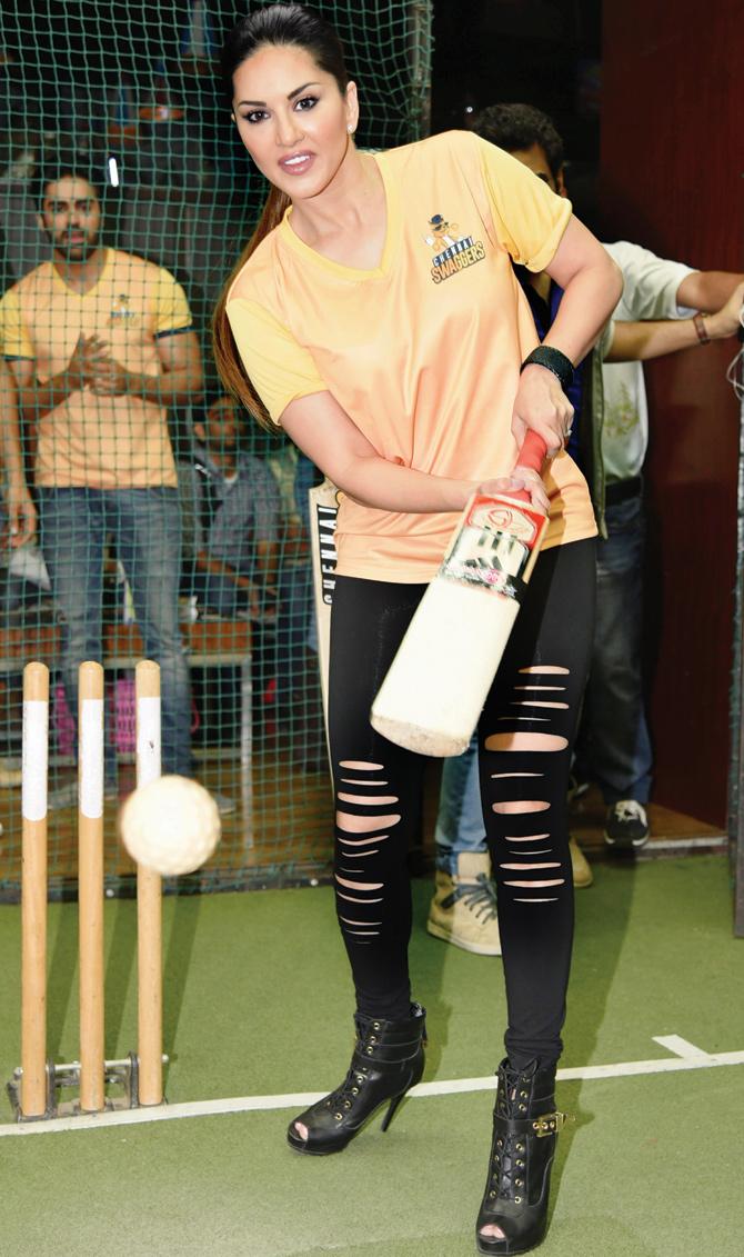 Actor Sunny Leone indulges in some  box cricket during a promotional event  in the city yesterday. pic/pti