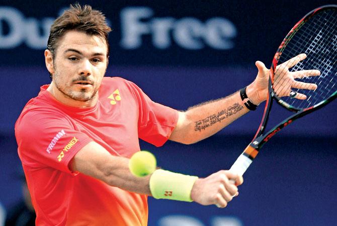 Stan Wawrinka during his semi-final match against Nick Kyrgios in Dubai yesterday. Pic/Getty Images