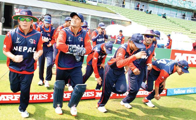 Nepal captain Raju Rijal (left) leads his team on the field for the U-19 match against India at Mirpur yesterday. Pic/ICC