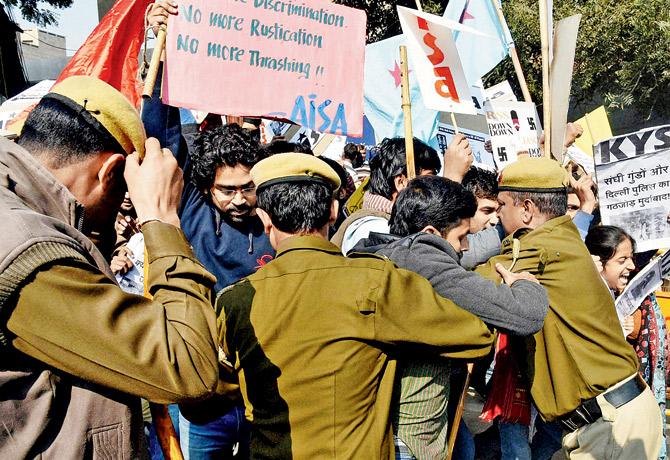 Police detain protesting AISA and KYS members yesterday. Pic/Pti 