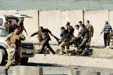 Taliban bomber strikes Kabul police base, kills 20