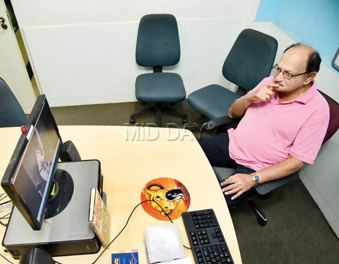 Former India captain Ajit Wadekar watches old cricket footage at the mid-day office on Monday. Pic/Shadab Khan