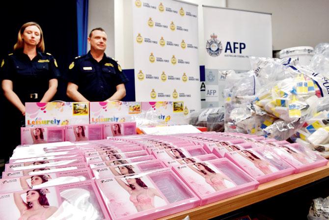 Gel bra inserts (foreground) containing concealed crystal methamphetamine at the Australian Federal Police headquarters in Sydney. PIC/AFP