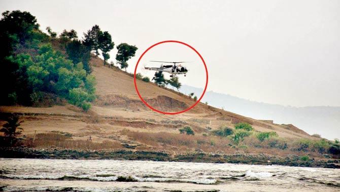 A Coast Guard chopper (circled) scans the sea for survivors and bodies