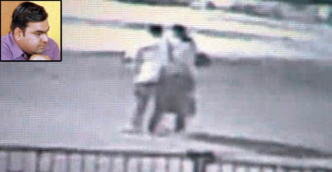 A CCTV grab of the incident that shows the woman approaching Damodariya (left) at the Karelibaug bus stand
