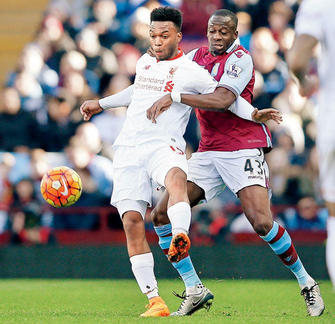 Liverpool’s Daniel Sturridge fends off a challenge by Aston Villa’s Aly Cissokho during their EPL tie in Birmingham
