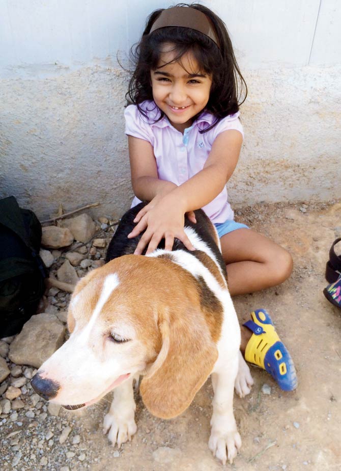 A dog chooses five-year-old Kimberly Fiahlo. The family adopted a pair which they name Xena and Thor. Pics/Mitali Parekh
