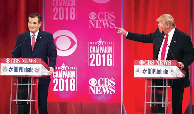 File pic of Donald Trump (R) and Ted Cruz (L) argue during the CBS News Republican Presidential Debate in Greenville. Pic/AFP
