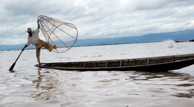 A fisherman goes about his daily business at Inle lake in Myanmar