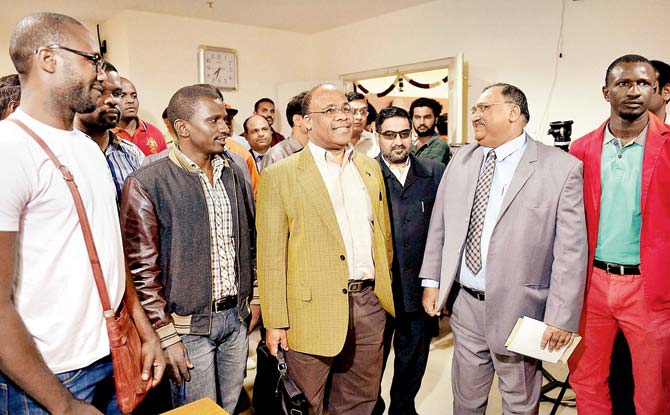Tanzania’s High Commissioner to India John Kijazi, Karnataka IGP Omprakash and African students at a meeting about the alleged attack on a female Tanzanian student in Bengaluru on Friday. Pic/PTI 