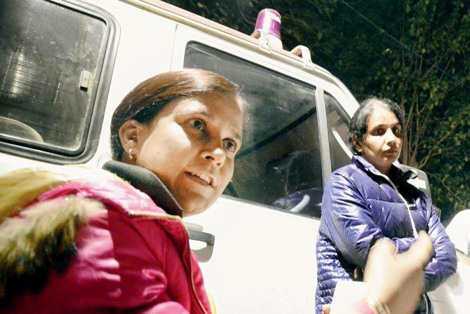 Jyotsana (in pink sweater) and Sudesh (in blue jacket) outside the mortuary. File pic