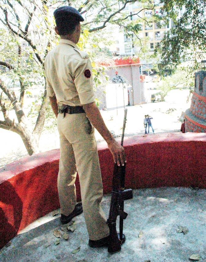 An SRPF guard mans the communally sensitive Durgadi Fort, which has religious significance for both Hindus and MuslimsAn SRPF guard mans the communally sensitive Durgadi Fort, which has religious significance for both Hindus and Muslims