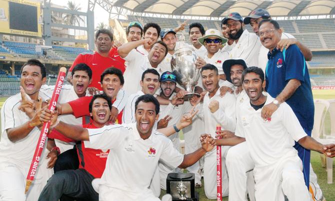 Ajit Agarkar’s team with the Ranji Trophy in 2013 at the Wankhede Stadium. Pics/mid-day archive