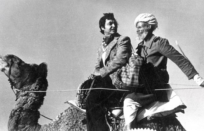 The iconic camel ride scene in the film Sonar Kella with Sourmitra Chatterjee