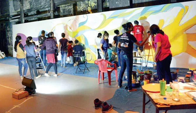 Young artists work as Bergner supervises