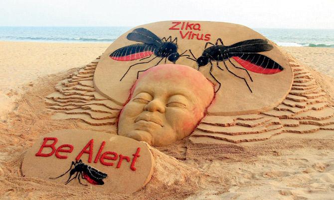 A sand sculpture, created by renowned sand artist Sudarsan Pattnaik, spreads awareness about the Zika virus at Puri beach in Odisha on Wednesday. PIC/PTI