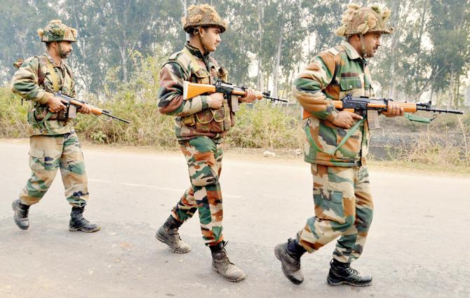 Security forces are sanitising the Pathankot IAF base. PIC/PTI