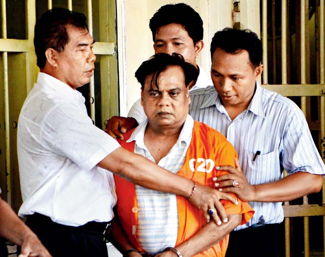 Chhota Rajan is escorted from a holding cell at the Bali police headquarters ahead of his deportation to India in November. File pic