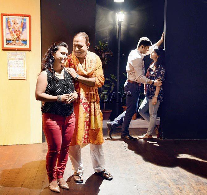 Om Katare  (in saffron kurta)  directs a scene during rehearsals for Jeene Bhi Do Yaaro; the play debuts at  the Yatri Festival.  Pic/Nimesh Dave