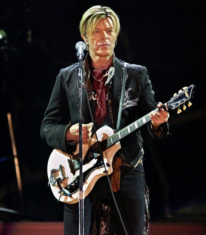 British rock legend David Bowie performs on stage at the Bercy stadium in Paris, France in 2003