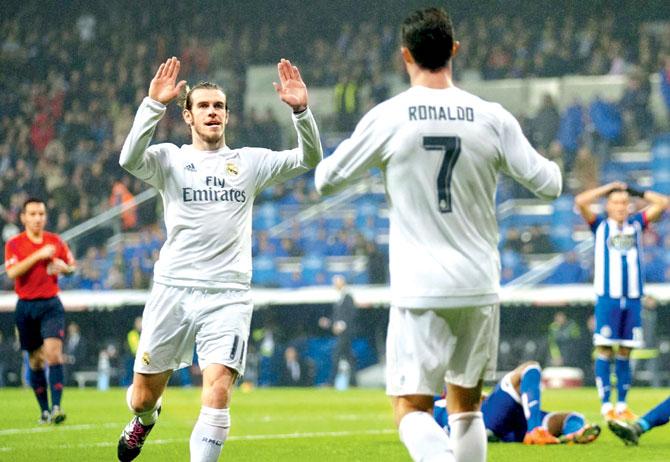 Gareth Bale (left) celebrates a goal with Cristiano Ronaldo