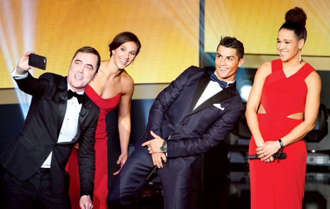 Just wanna have fun: James Nesbitt, presenter of the show, takes a selfie with Carli Lloyd (left) of the USA, Cristiano Ronaldo and Germany