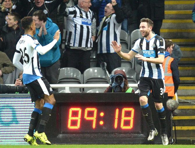 Newcastle United-s Welsh defender Paul Dummett R celebrates with Newcastle United-s English striker Ivan Toney L after scoring Newcastle-s third goal during the English Premier League football match between Newcastle United and Manchester United at St James- Park in Newcastle-upon-Tyne. Pic/AFP