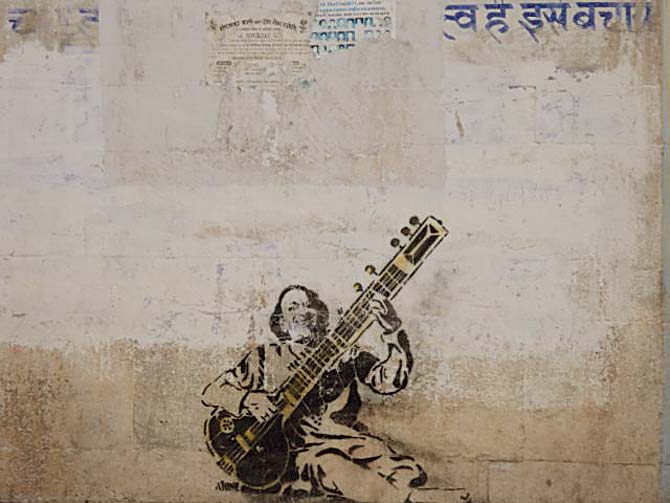 A wall near Udaipur’s Gangaur Ghat displays a graffiti tribute to late Pandit Ravi Shankar