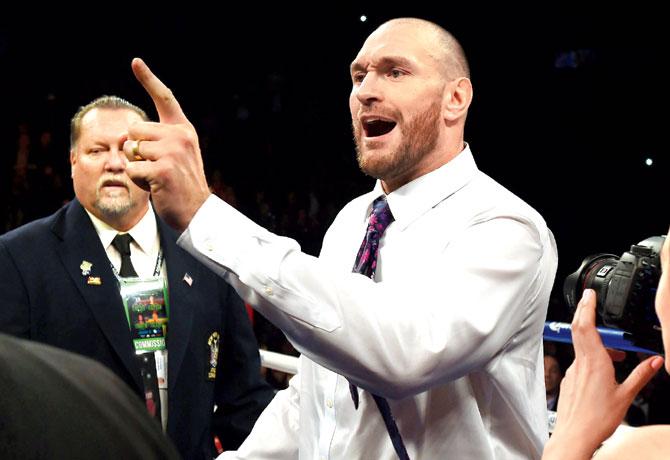 WBA title holder Tyson Fury challenges Deontay Wilder in New York on Saturday