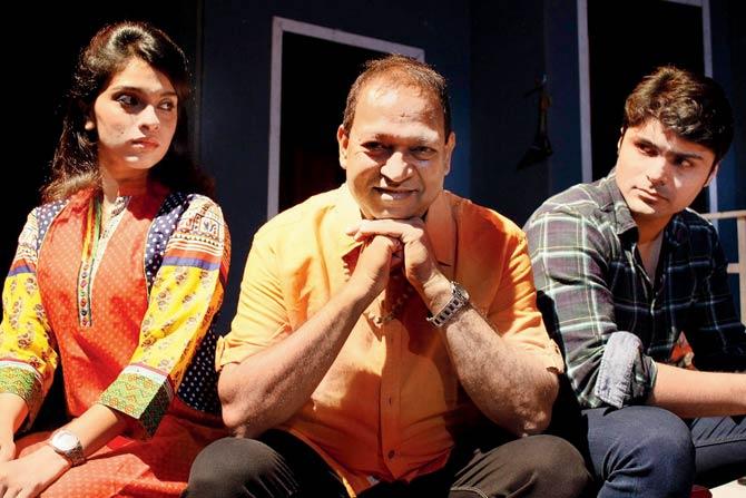 Om Katare (centre) with two of his cast members