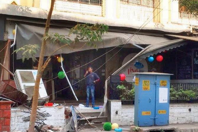 Eat Thai’s air conditioner stand and a portion of its wall was demolished along with the illegal canopy. The owner claims the BMC took away a computer and a motorcycle as well.
