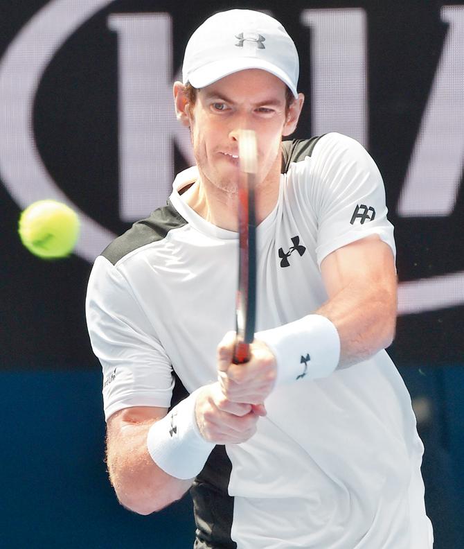Andy Murray plays a backhand return during his singles match against Australia’s Sam Groth in Australian Open yesterday. Pic/AFP