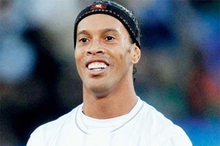 Close shave: Ronaldinho has a miraculous escape as rusted traffic light post falls