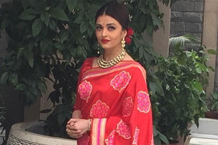 Aishwarya looks ravishing in red for lunch with French President Hollande