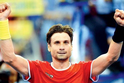 David Ferrer into quarters without dropping a set