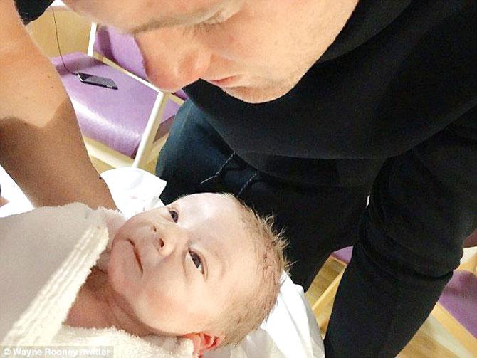 Wayne Rooney with his new-born baby. Pic/Rooney