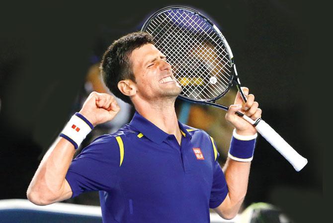 Novak Djokovic exults after beating Roger Federer in the Australian Open semi-final yesterday. Pic/Getty Images