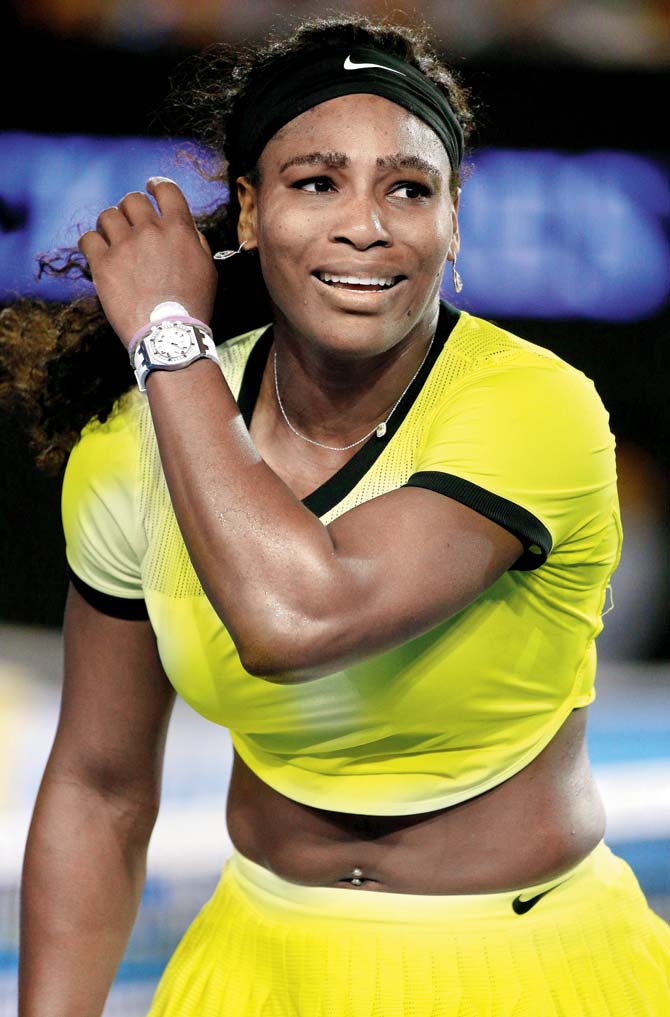 Serena Williams reacts after her defeat to Angelique Kerber (left) at Melbourne Park on Saturday. Pics/Getty Images