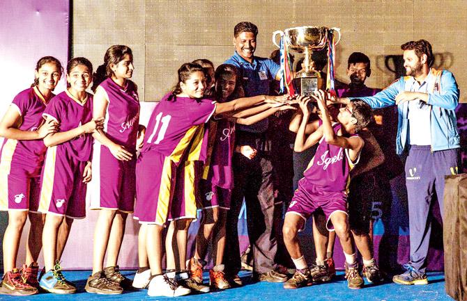 Fr Agnel Multipurpose High School students lift the Team Championship Trophy during the inaugural SFA inter-school tournament. Fr Agnel finished in pole position with 94 points