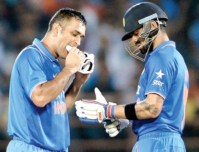 MS Dhoni (left) and Virat Kohli during overs break against South Africa in Rajkot last October. Pic for representation purpose only