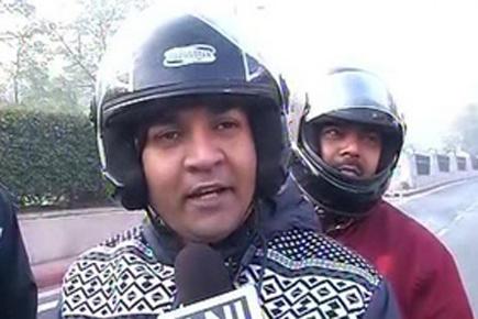 Delhi Minister uses bike for transportation