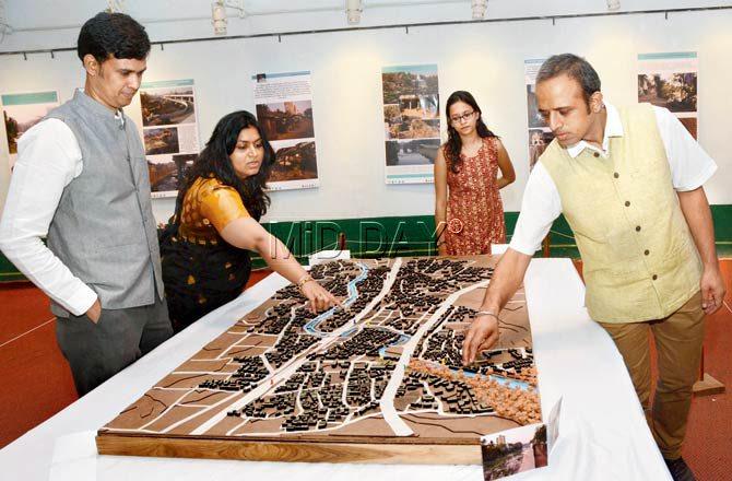 (L - R) Ajay Nayak, Kimaya Keluskar, Apoorva Iyengar and Vikram Pawar of Water Environs with an architectural model of urbanisation on the banks of the Dahisar river. Pics/Satej Shinde